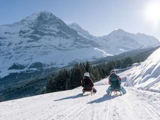 Sledding on the Männlichen. The trail offers a unique view of the Eiger.