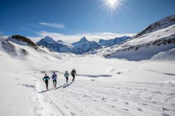 A group of runners participating in the Winter Trail Running event at Bachalpsee.