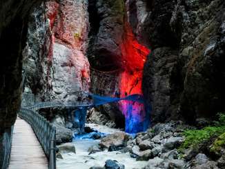 The Grindelwald Glacier Gorge bathed in red and blue light.