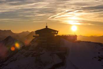 The setting sun makes for beautiful photos of the Schilthorn. The surrounding mountains appear as a silhouette.