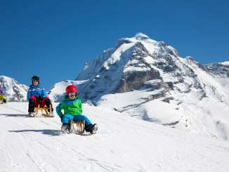 Sledding in Mürren on the Apollo Run sledding trail.